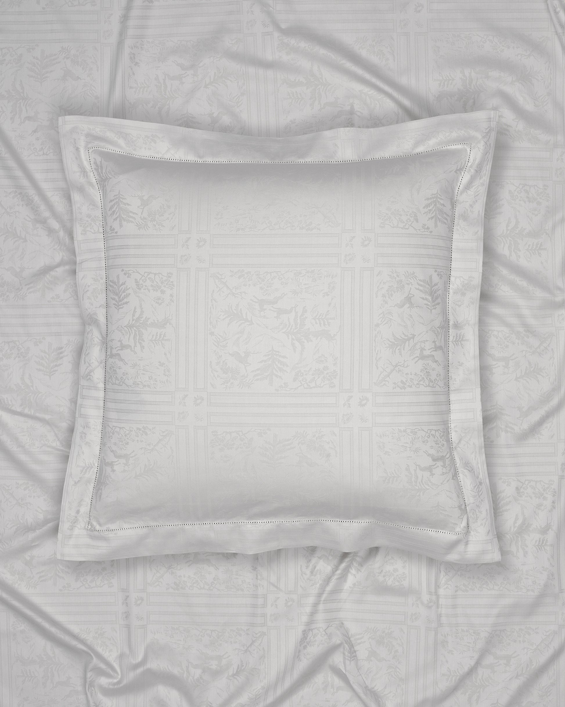 Gray pillow on a textured gray fabric background