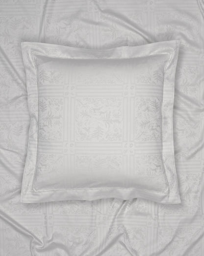 Gray pillow on a textured gray fabric background